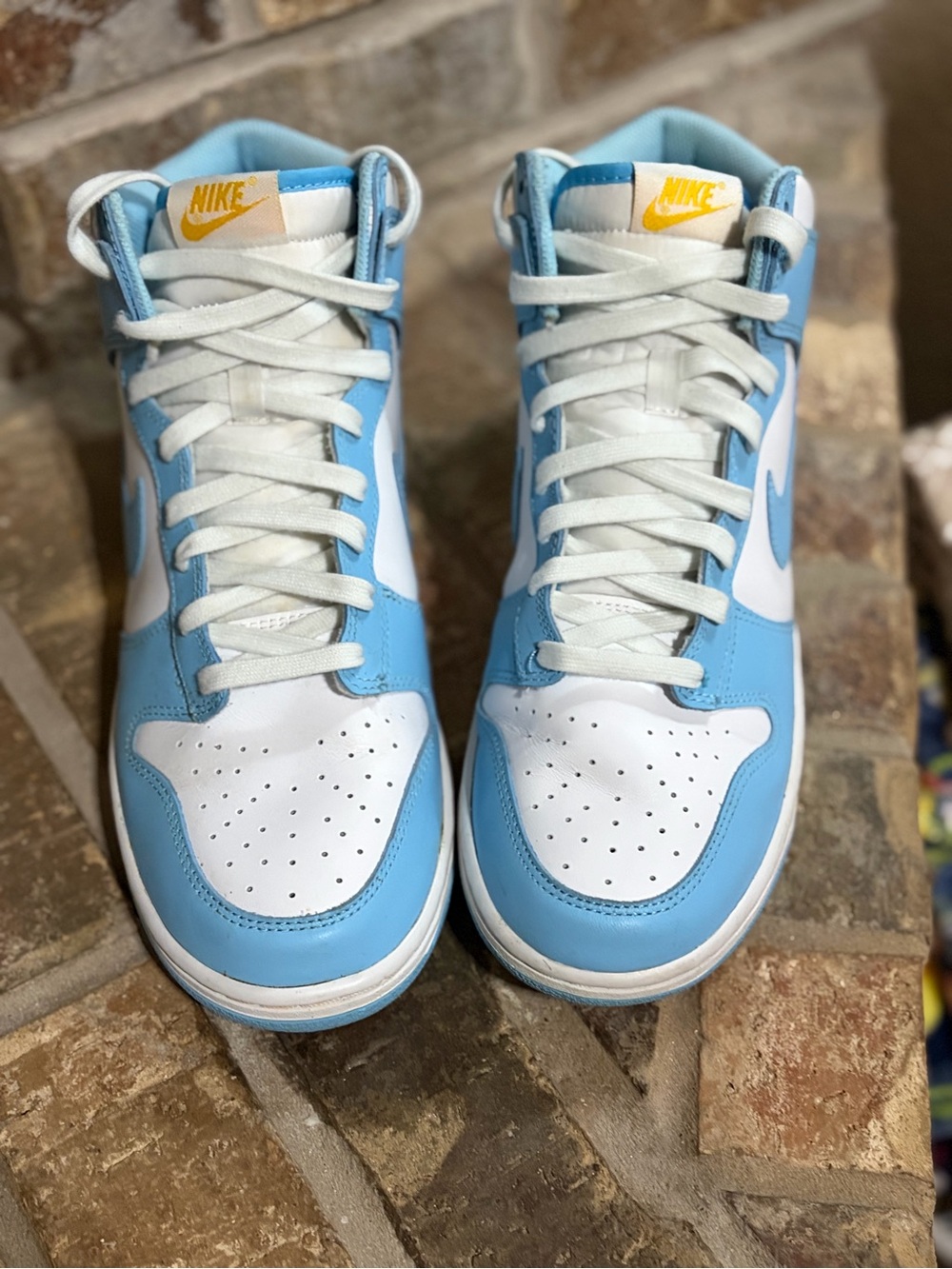 Nike Light Blue and White High-Top Sneakers with Yellow Logo